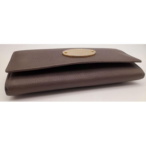 354 - A Mulberry Khaki Continental Wallet. Leather exterior with a zipped compartment to back and double p... 