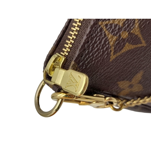 361 - A Louis Vuitton My LV Heritage Mini Pochette Accessories. Monogram coated canvas exterior with gold-... 