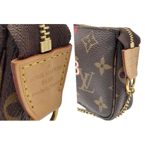 361 - A Louis Vuitton My LV Heritage Mini Pochette Accessories. Monogram coated canvas exterior with gold-... 