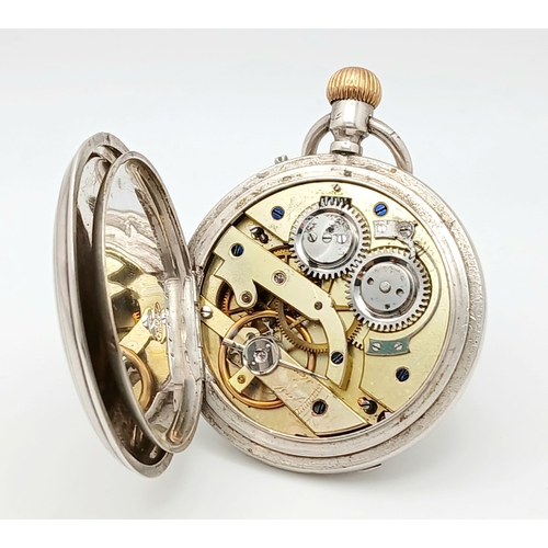 400 - A Silver Half Hunter Pocket Watch. Hallmarks. In working order but because of age no guarantees. 94g... 