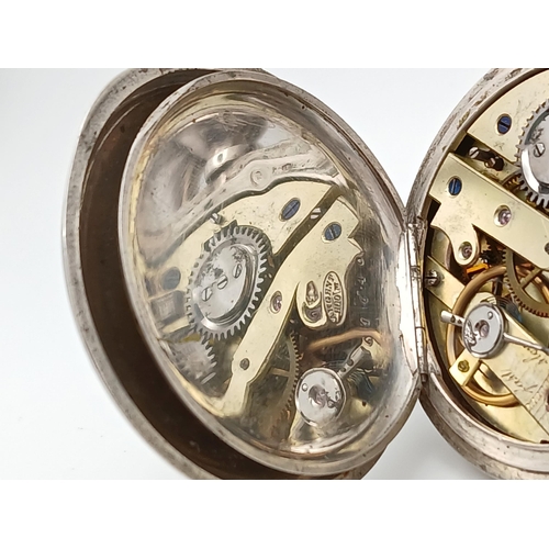 400 - A Silver Half Hunter Pocket Watch. Hallmarks. In working order but because of age no guarantees. 94g... 