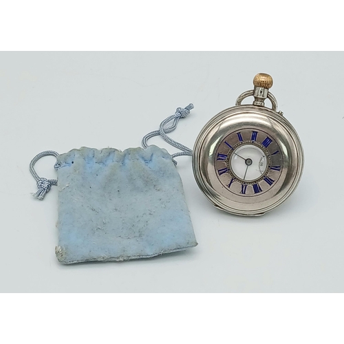 400 - A Silver Half Hunter Pocket Watch. Hallmarks. In working order but because of age no guarantees. 94g... 