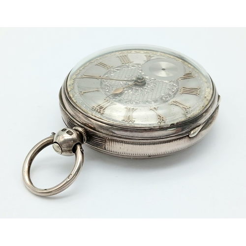 407 - A Silver Pocket Watch. Hallmarks. Comes with key. In working order but because of age no guarantees.... 