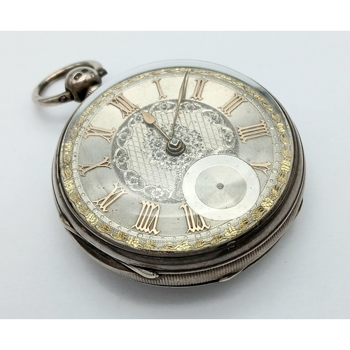 407 - A Silver Pocket Watch. Hallmarks. Comes with key. In working order but because of age no guarantees.... 