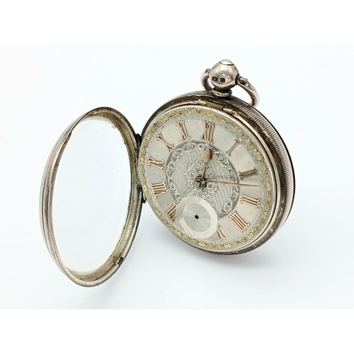 407 - A Silver Pocket Watch. Hallmarks. Comes with key. In working order but because of age no guarantees.... 