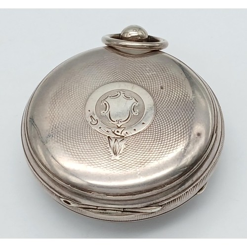 407 - A Silver Pocket Watch. Hallmarks. Comes with key. In working order but because of age no guarantees.... 