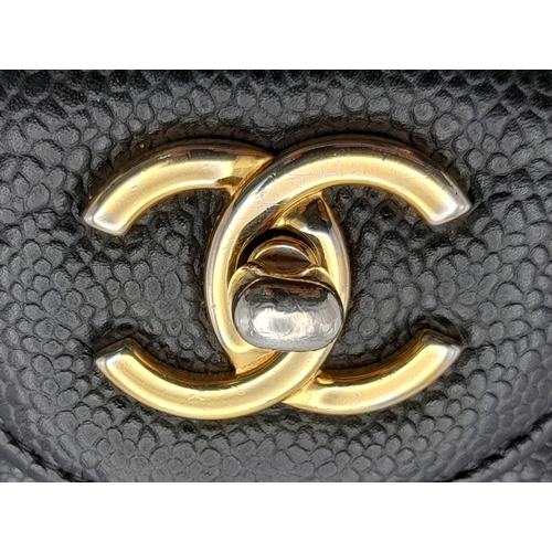 101 - A Chanel Black Classic Double Flap Bag. Quilted leather exterior with gold-toned hardware, chain and... 