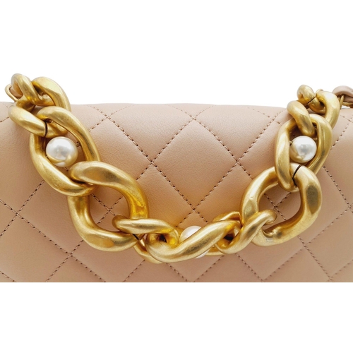 108 - A Chanel Nude Pearl Chain Bag. Quilted leather exterior with gold-toned hardware, heavy chain and cu... 