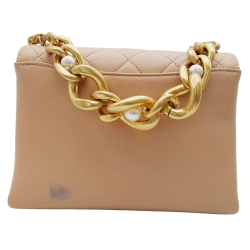 108 - A Chanel Nude Pearl Chain Bag. Quilted leather exterior with gold-toned hardware, heavy chain and cu... 