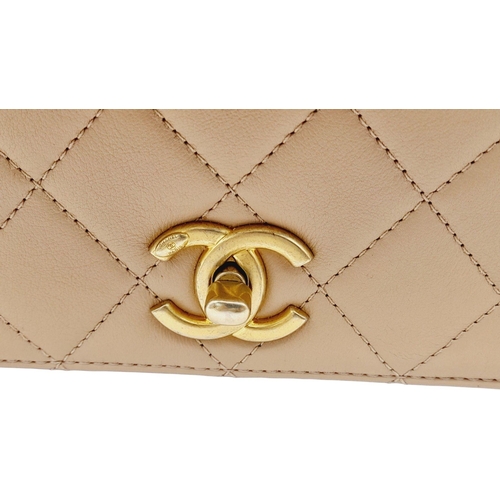 108 - A Chanel Nude Pearl Chain Bag. Quilted leather exterior with gold-toned hardware, heavy chain and cu... 