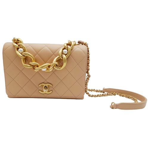 108 - A Chanel Nude Pearl Chain Bag. Quilted leather exterior with gold-toned hardware, heavy chain and cu... 