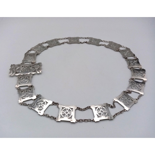 162 - A Sterling Silver Elaborate Ladies Fashion Belt. Pierced decoration. 79cm length. 112g