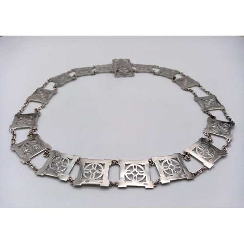 162 - A Sterling Silver Elaborate Ladies Fashion Belt. Pierced decoration. 79cm length. 112g