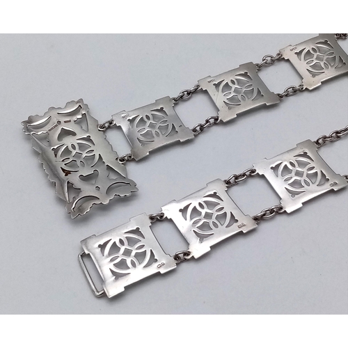 162 - A Sterling Silver Elaborate Ladies Fashion Belt. Pierced decoration. 79cm length. 112g