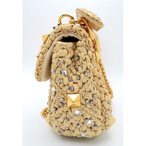 206 - A Valentino Beige Roman Bag. Woven raffia, crystal and stud embellished exterior with gold-toned har... 