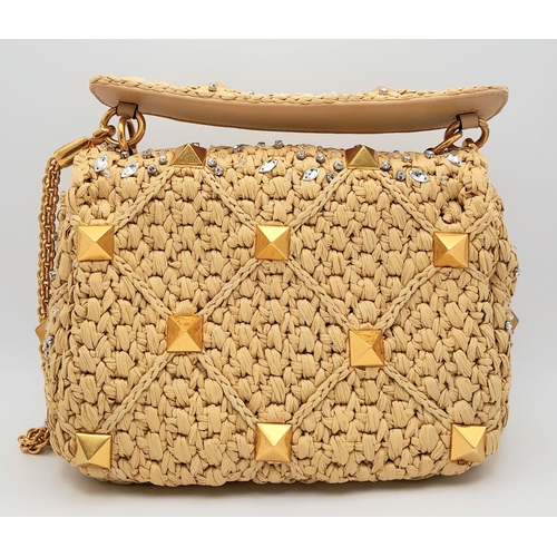 206 - A Valentino Beige Roman Bag. Woven raffia, crystal and stud embellished exterior with gold-toned har... 