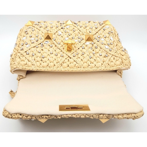 206 - A Valentino Beige Roman Bag. Woven raffia, crystal and stud embellished exterior with gold-toned har... 