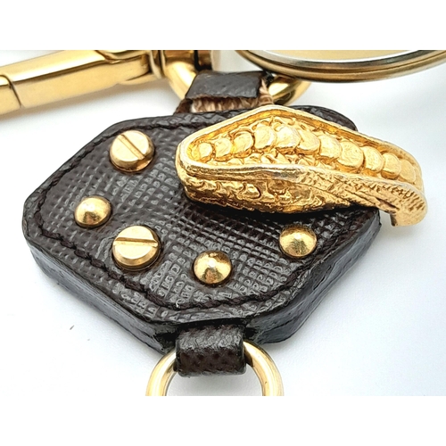 234 - A Prada Furry Keyring. Gold-toned hardware with a tough leather body and furry finish. Comes with du... 