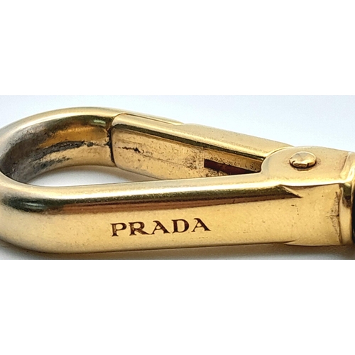 234 - A Prada Furry Keyring. Gold-toned hardware with a tough leather body and furry finish. Comes with du... 