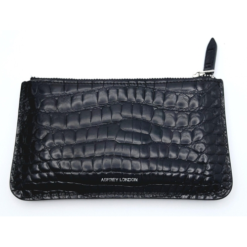 241 - An Asprey Black Coin Purse. Crocodile leather exterior with silver-toned hardware and zip top closur... 