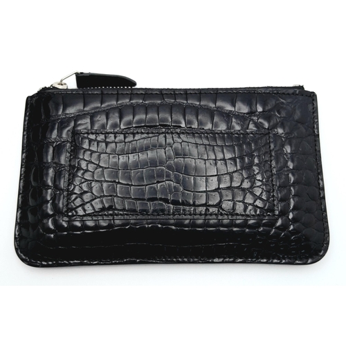 241 - An Asprey Black Coin Purse. Crocodile leather exterior with silver-toned hardware and zip top closur... 