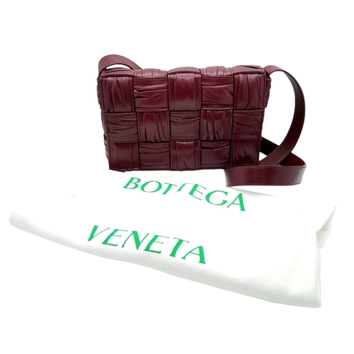 291 - A Bottega Veneta Brick Cassette Bag. Smooth burgundy leather, signature orthogonal weaving, adjustab... 