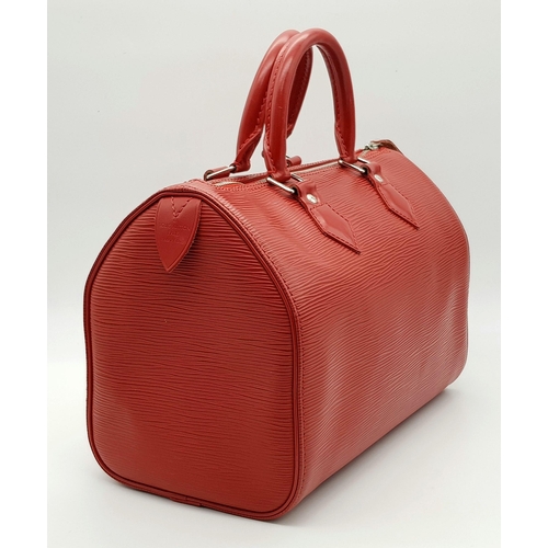 319 - A Louis Vuitton Red Speedy Bag. Epi leather exterior with silver-toned hardware, two rolled leather ... 