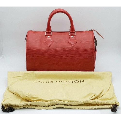 319 - A Louis Vuitton Red Speedy Bag. Epi leather exterior with silver-toned hardware, two rolled leather ... 