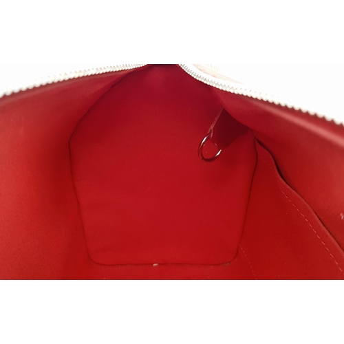 319 - A Louis Vuitton Red Speedy Bag. Epi leather exterior with silver-toned hardware, two rolled leather ... 