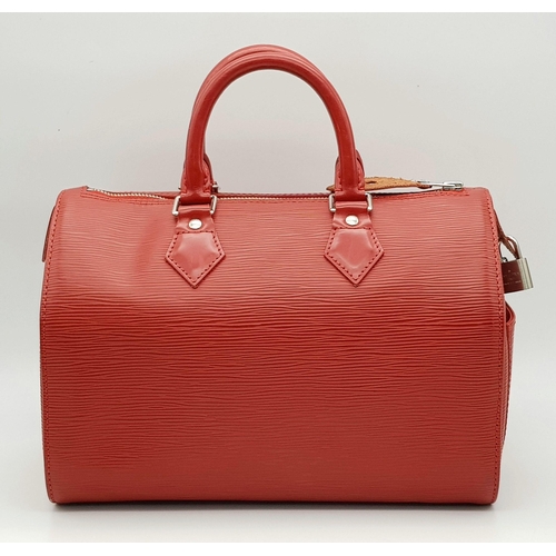 319 - A Louis Vuitton Red Speedy Bag. Epi leather exterior with silver-toned hardware, two rolled leather ... 