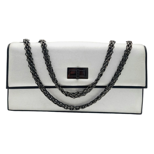 326 - A Chanel Metallic Silver Shoulder Bag. Leather exterior with black-toned hardware, chain strap and t... 