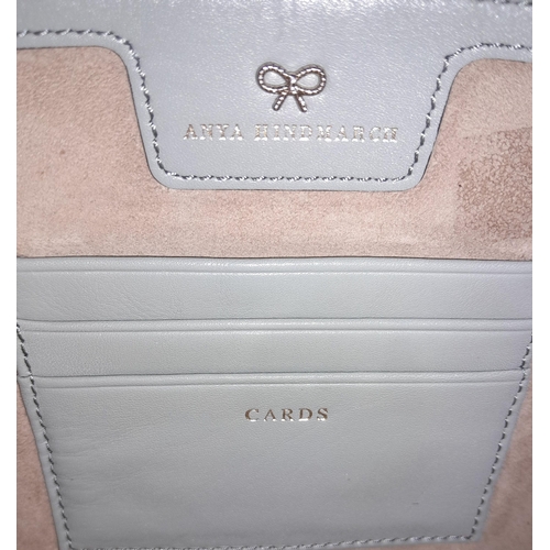 368 - An Anya Hindmarch Grey Clutch Bag. Leather exterior with gold-toned hardware zip top closure. Grey l... 