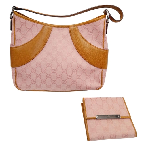 1 - A Gucci Rose Coloured Handbag and Matching Purse. Pink monogram cloth exterior with leather trim. Ba... 