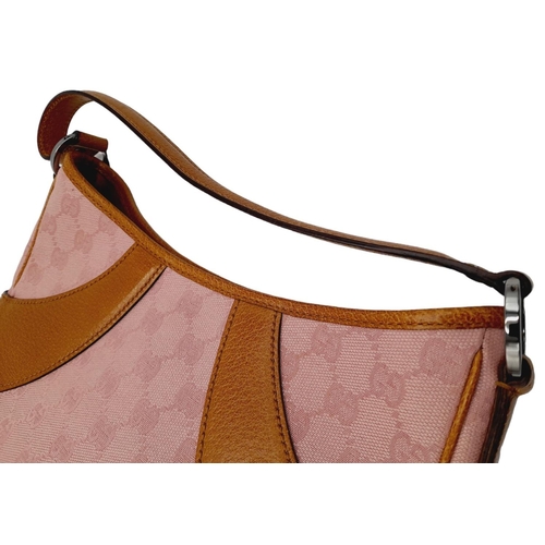 1 - A Gucci Rose Coloured Handbag and Matching Purse. Pink monogram cloth exterior with leather trim. Ba... 