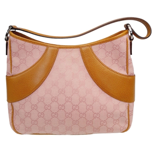 1 - A Gucci Rose Coloured Handbag and Matching Purse. Pink monogram cloth exterior with leather trim. Ba... 