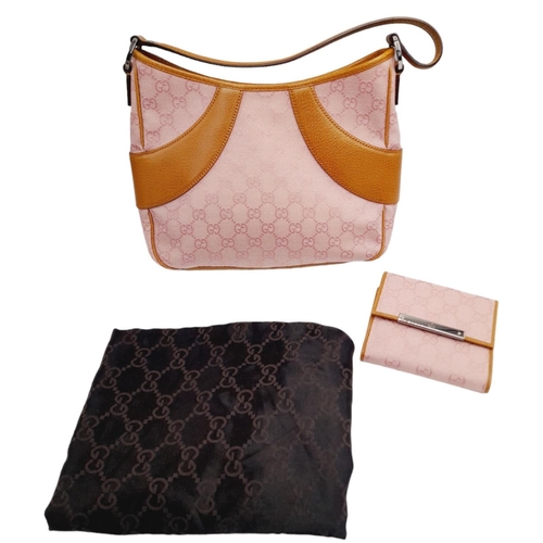 1 - A Gucci Rose Coloured Handbag and Matching Purse. Pink monogram cloth exterior with leather trim. Ba... 