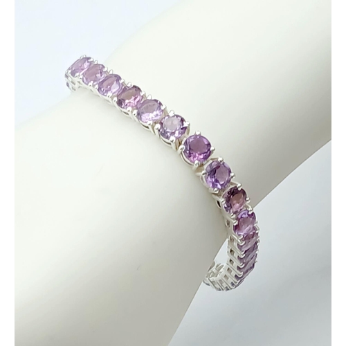 127 - An Amethyst Gemstone Tennis Bracelet set in 925 Silver. 18cm. 19g. CD-1368