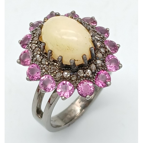 169 - A 2.3ct Opal Cabochon Ring with a 2ctw Rhodolite Surround and 0.35ctw of Diamond Accents. Set in 925... 