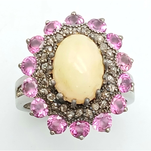 169 - A 2.3ct Opal Cabochon Ring with a 2ctw Rhodolite Surround and 0.35ctw of Diamond Accents. Set in 925... 