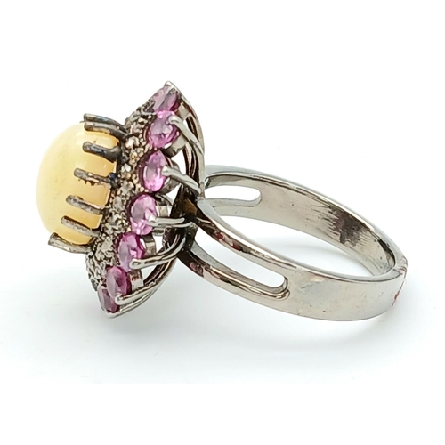 169 - A 2.3ct Opal Cabochon Ring with a 2ctw Rhodolite Surround and 0.35ctw of Diamond Accents. Set in 925... 