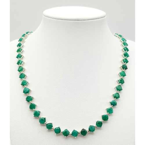 17 - An Emerald Gemstone Tennis Necklace set in 925 Silver. 44cm. 35.5g. CD-1375