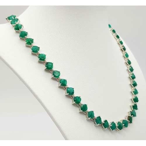 17 - An Emerald Gemstone Tennis Necklace set in 925 Silver. 44cm. 35.5g. CD-1375