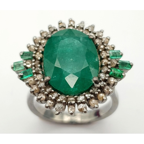 183 - A 7.70ct Emerald Ring with 0.85ctw of Diamond Surround and 0.27ct Emerald Accents. Size O. Comes wit... 