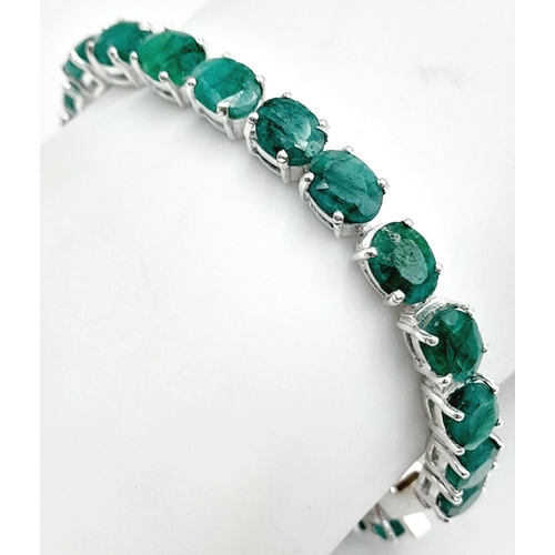 254 - An Emerald Gemstone Tennis Bracelet set in 925 Silver. 18cm length. 16.5g. CD-1369