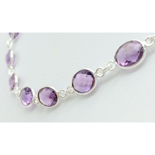 261 - An Amethyst Gemstone Chain Necklace set in 925 Silver. Oval cut. 48cm. 19g. CD-1372