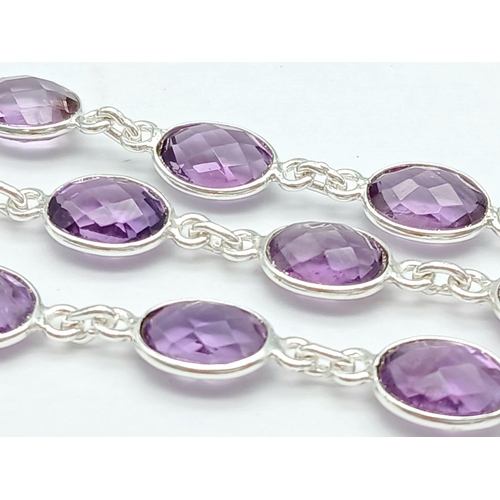 261 - An Amethyst Gemstone Chain Necklace set in 925 Silver. Oval cut. 48cm. 19g. CD-1372