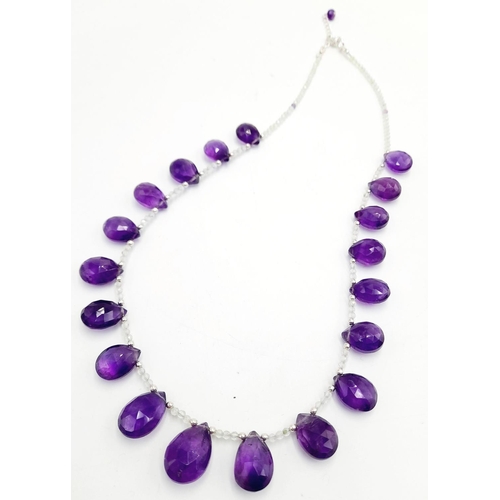 275 - A 145ctw Amethyst Gemstone Drop Necklace with Moonstone Beads - 925 Silver clasp. 42cm. CD-1382