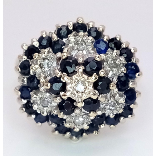 278 - A 9K YELLOW GOLD, DIAMOND & SAPPHIRE FLORAL FORM RING - 5.3G. SIZE Q. REF: SC4001