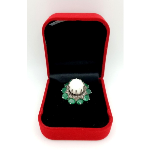 72 - A 6.85ct Opal Cabochon Ring with 3.95ctw of Emerald and Old Cut Diamond Accents. Size N. Comes with ... 