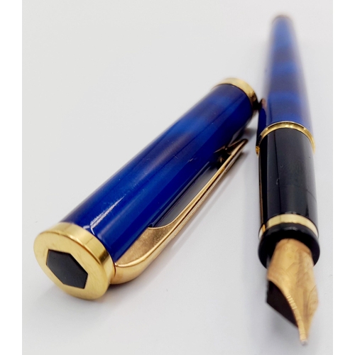 570 - A Watermans Decorative Blue Lacquer Pen with 18K Gold Nib. 13cm length.